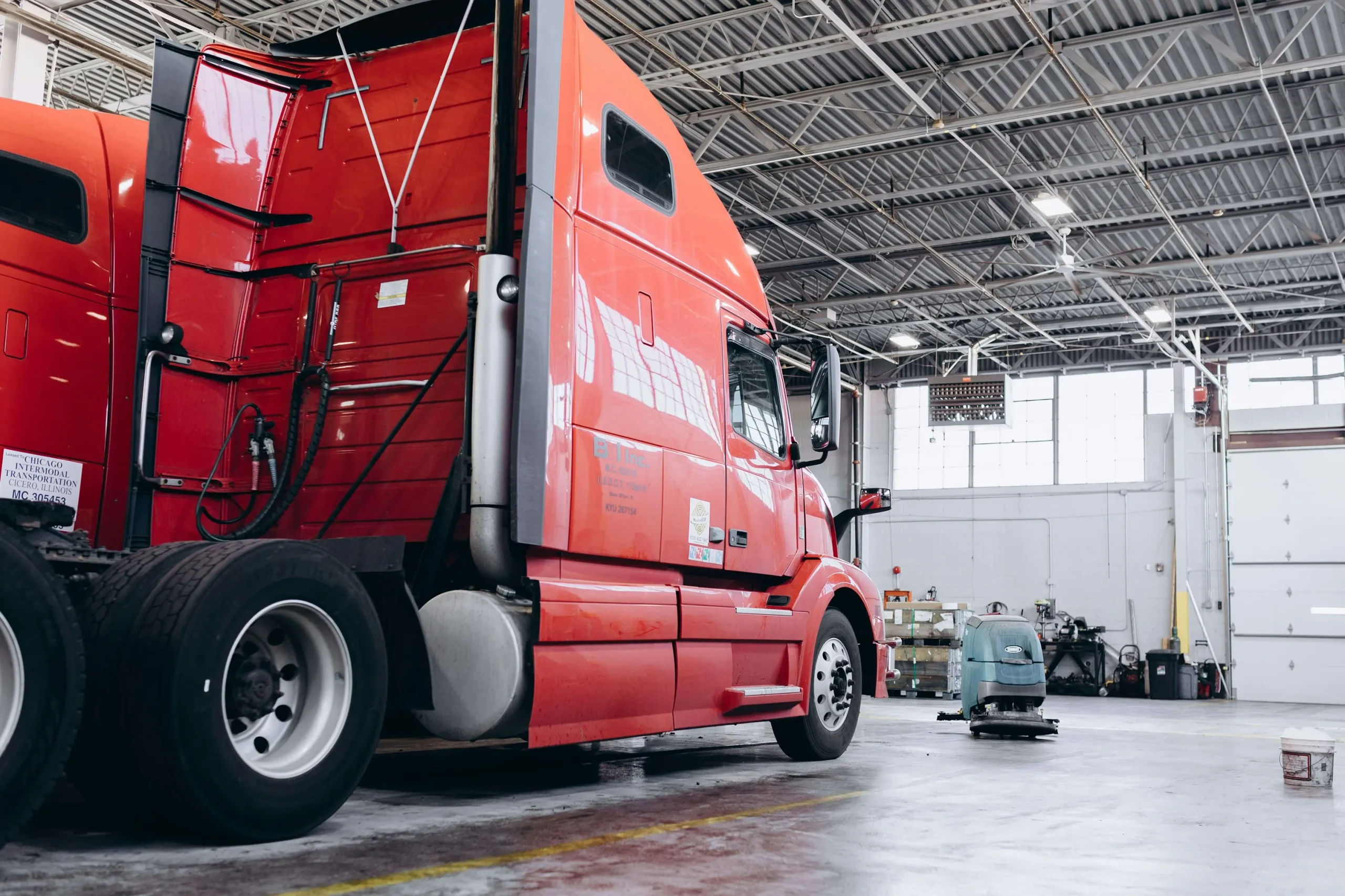 Blue fleet truck in the shop during a maintenance inspection